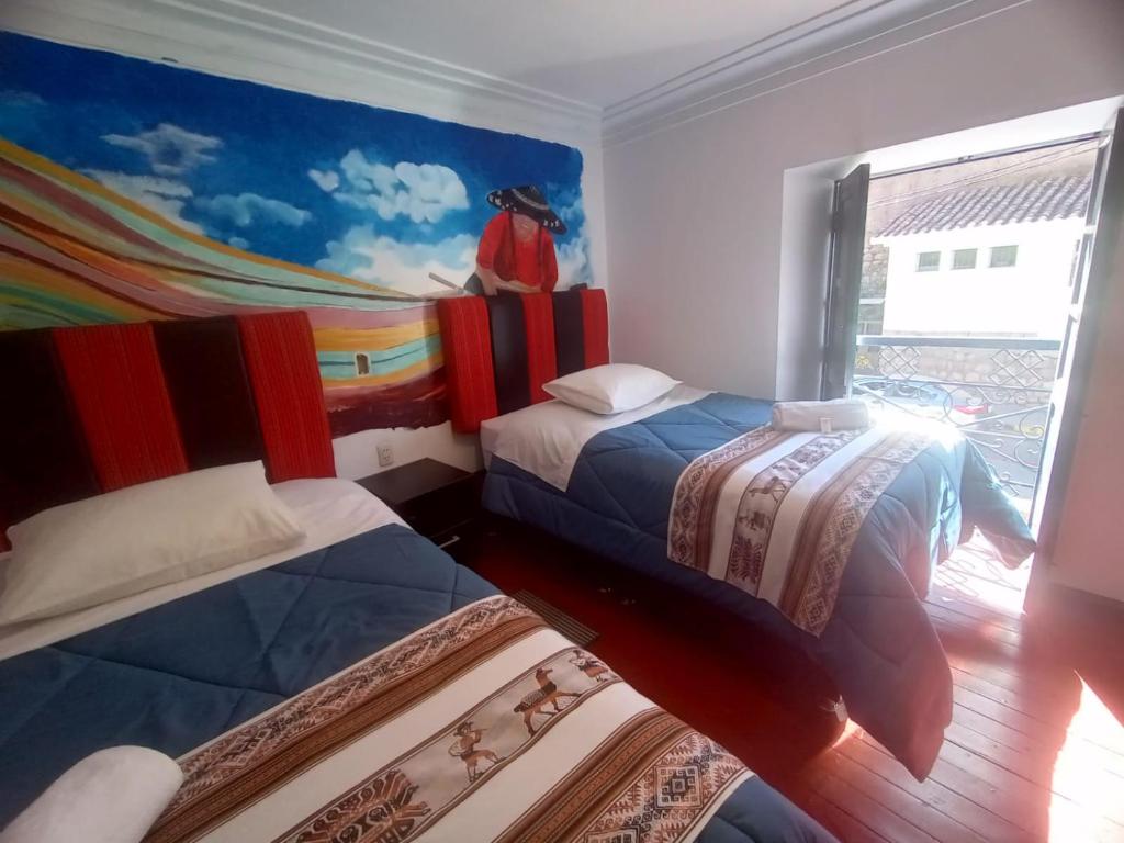 Cama o camas de una habitación en America Guest House
