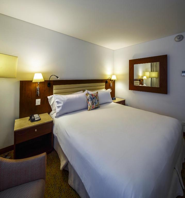 Postel nebo postele na pokoji v ubytování Hotel Chico 97