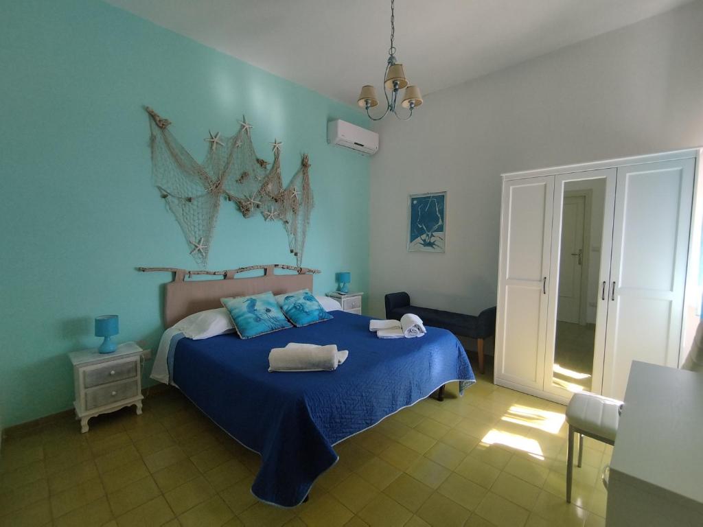 Postel nebo postele na pokoji v ubytování Il Sogno di Vincenzo e Maria
