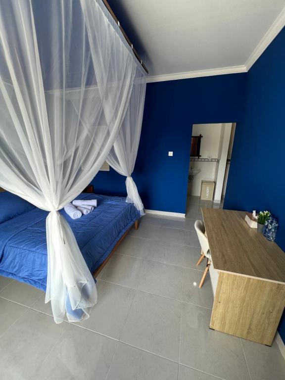 Postel nebo postele na pokoji v ubytování Varmana Ubud Guest House