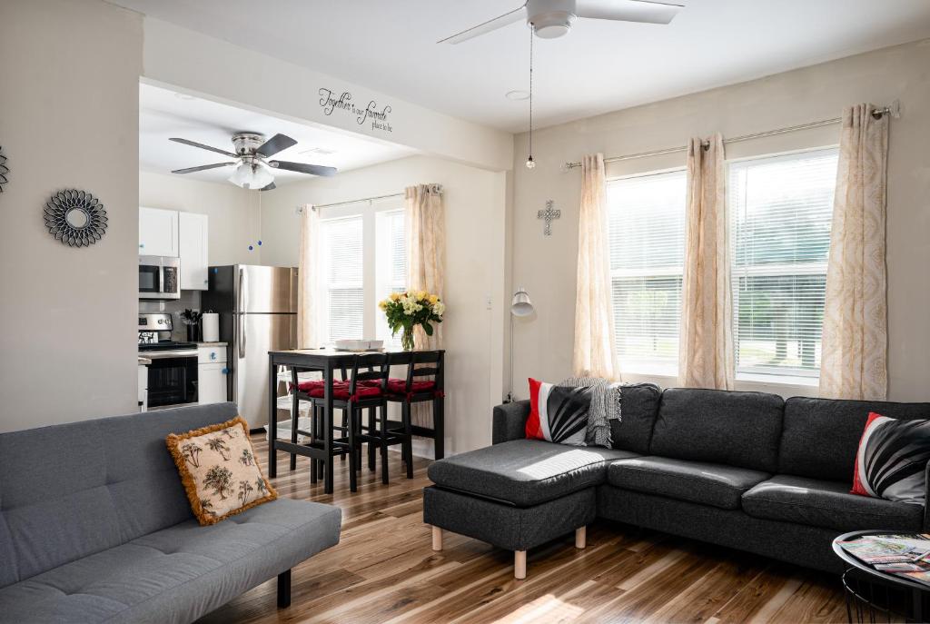 a living room with a couch and a table at Ricehope Place in Charleston