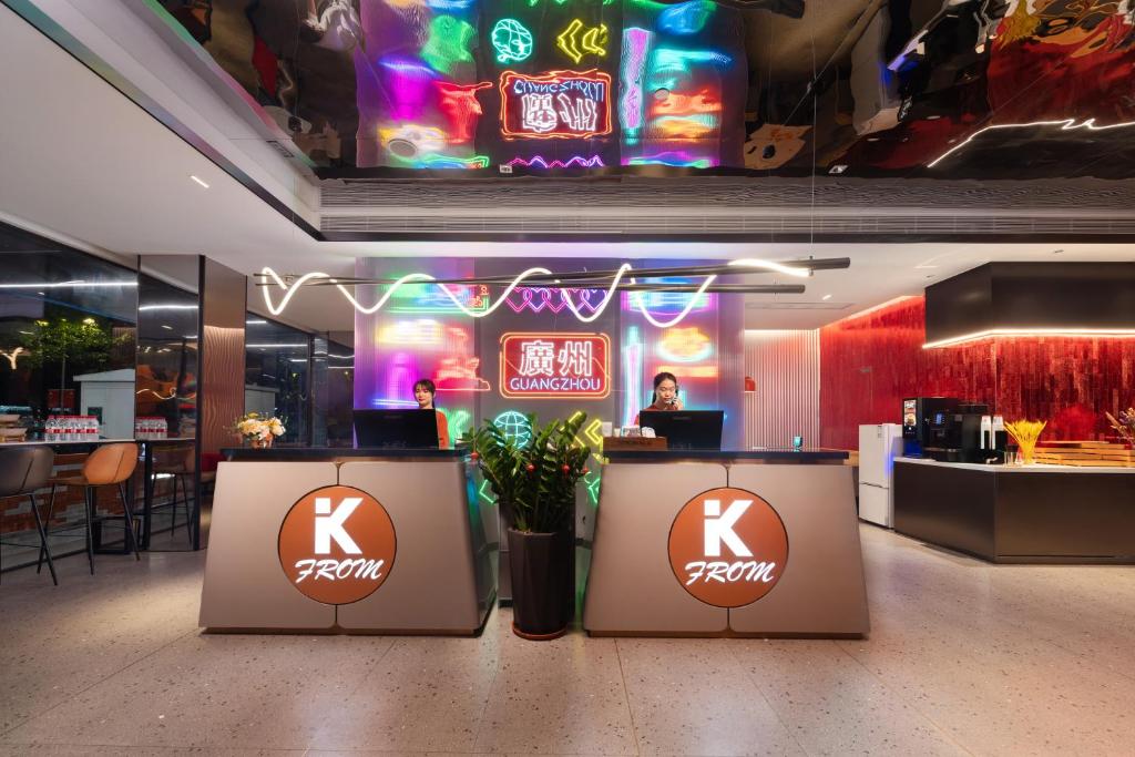 a restaurant with a krispy kreme sign on the wall at From K Huan Kai Hotel Tiyuxi Metro Station- Free transportation during the Canton Fair in Guangzhou