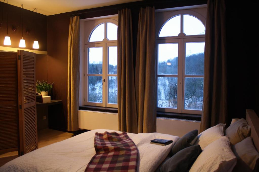 Postel nebo postele na pokoji v ubytování B&B Les Dépendances