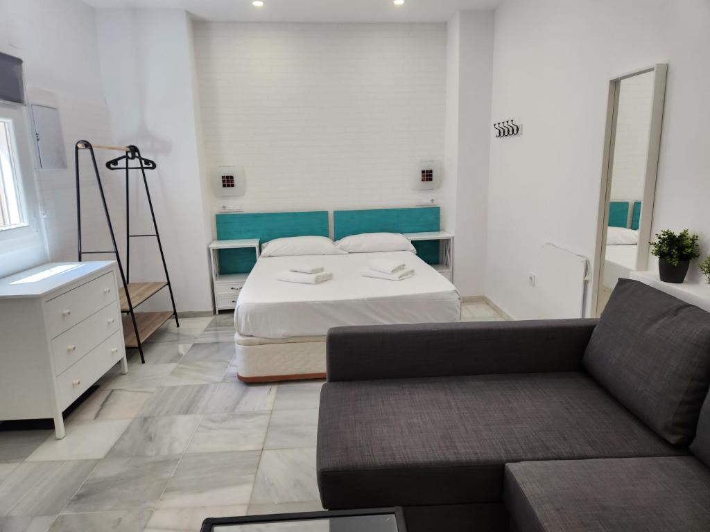 Posteľ alebo postele v izbe v ubytovaní Allo Apartments "Real Escuela" Centro Loft