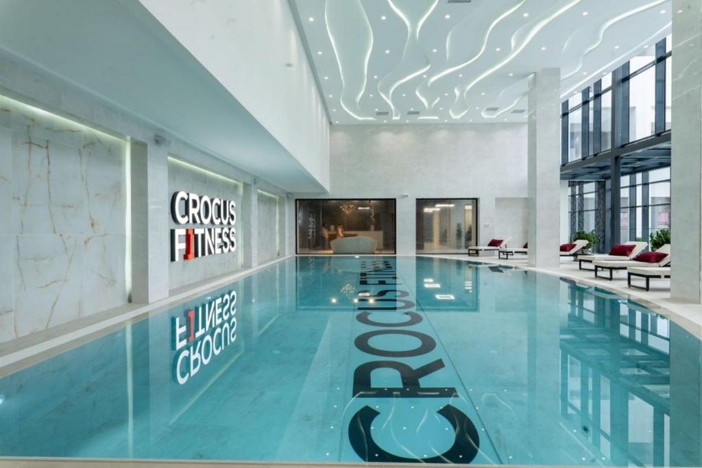 a large swimming pool in a building at Sabah Residance in Baku