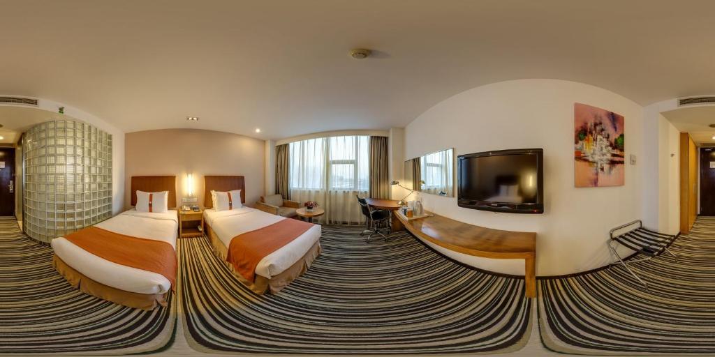 Postel nebo postele na pokoji v ubytování Holiday Inn Express Shanghai Jinqiao Central by IHG