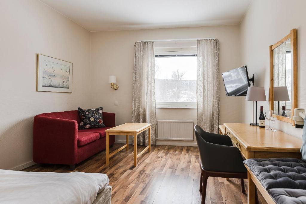 TV a/nebo společenská místnost v ubytování Hotell Kramm