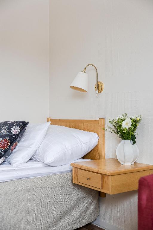 Postel nebo postele na pokoji v ubytování Hotell Kramm