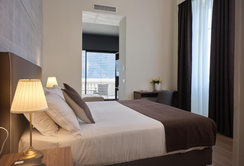 Postel nebo postele na pokoji v ubytování Hotel Ghiffa