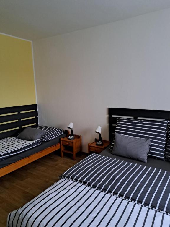 Postel nebo postele na pokoji v ubytování Penzion a Pizzerie Na Záložně