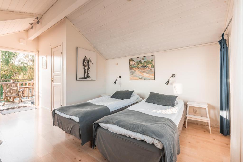 Postel nebo postele na pokoji v ubytování Nösund Havshotell