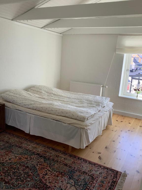 Postel nebo postele na pokoji v ubytování Hotel Vestkysten