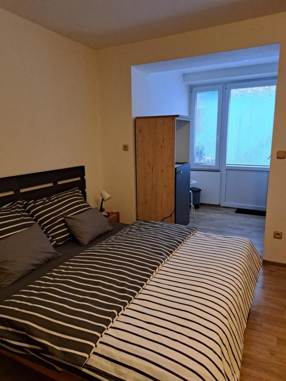 Postel nebo postele na pokoji v ubytování Penzion a Pizzerie Na Záložně