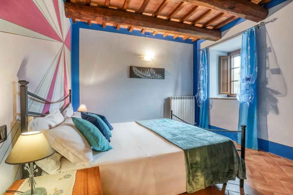 Łóżko lub łóżka w pokoju w obiekcie Agriturismo Podere San Giorgio