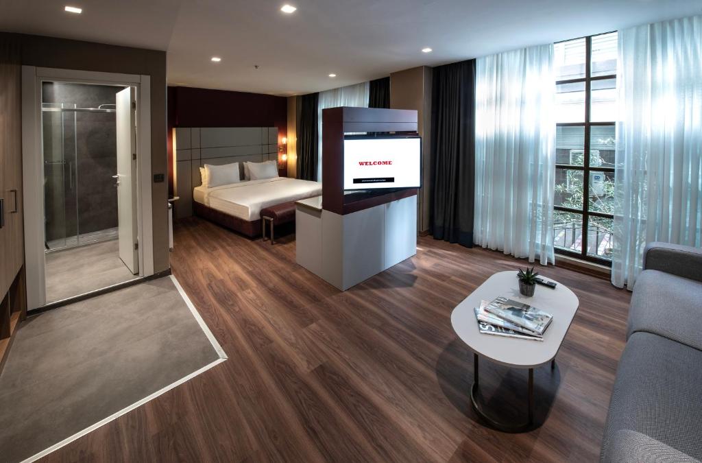 Postel nebo postele na pokoji v ubytování Hotel Bosfora