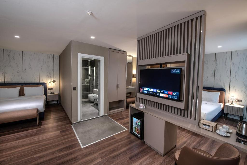 Postel nebo postele na pokoji v ubytování Hotel Bosfora