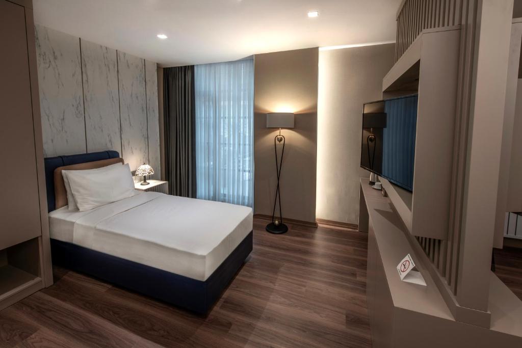 Postel nebo postele na pokoji v ubytování Hotel Bosfora