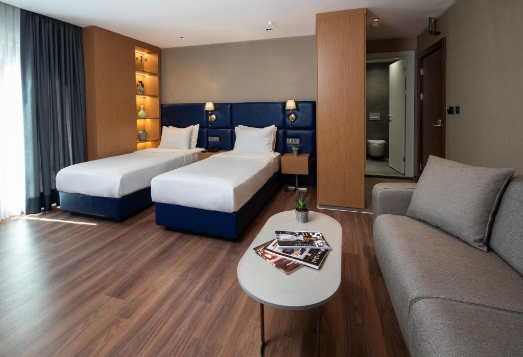 Postel nebo postele na pokoji v ubytování Hotel Bosfora