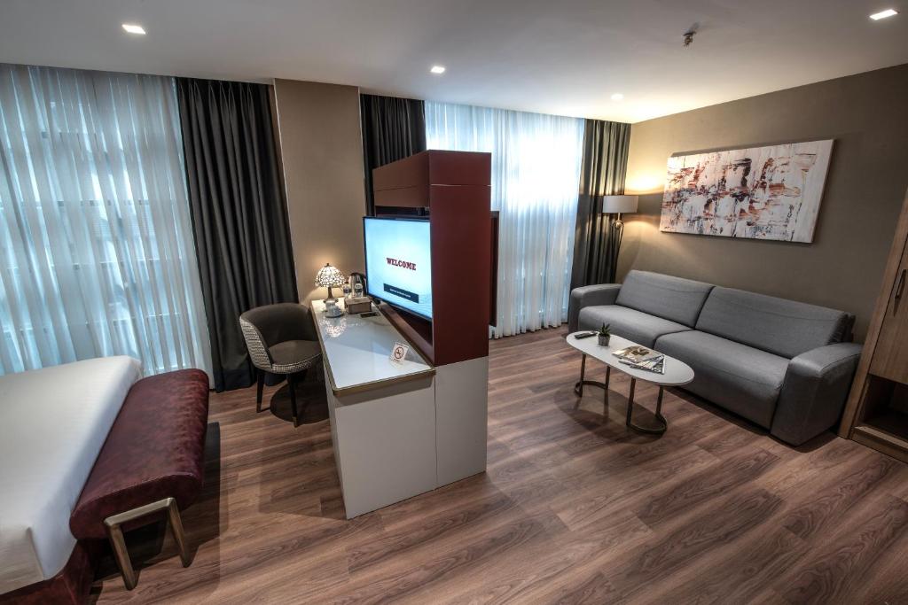 TV a/nebo společenská místnost v ubytování Hotel Bosfora