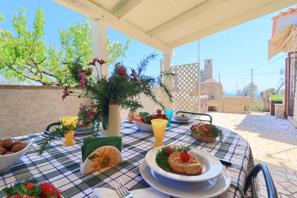 a table with a plate of food on a table at Foresta Forte Leuca by LoveSud in Leuca