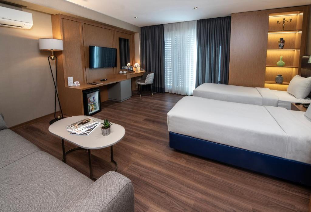 Postel nebo postele na pokoji v ubytování Hotel Bosfora