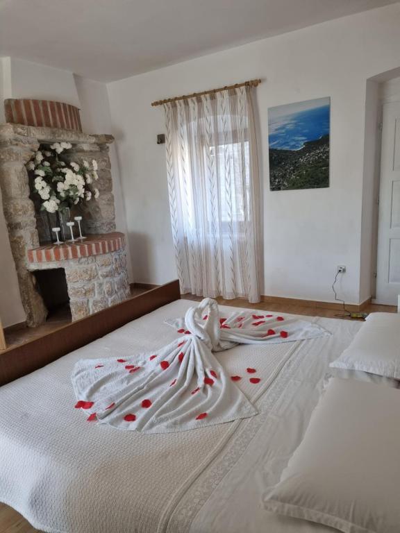 Postel nebo postele na pokoji v ubytování Apartmani Milenko Lubenice