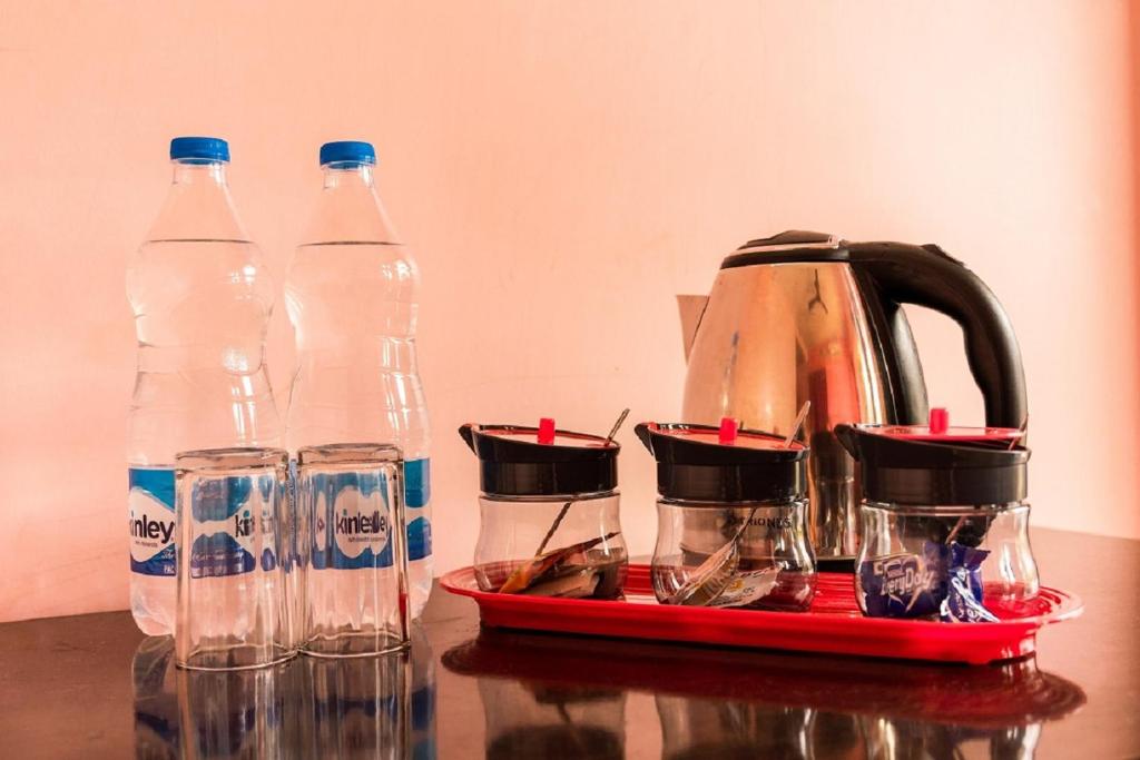 a group of bottles of water sitting on a table at Hotel The Imperio in New Delhi