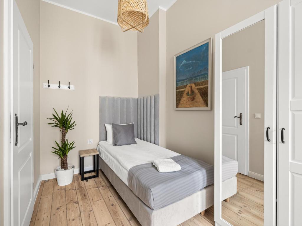 Postel nebo postele na pokoji v ubytování Boho Rooms Sopot