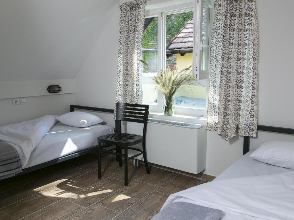 Postel nebo postele na pokoji v ubytování Varad INN
