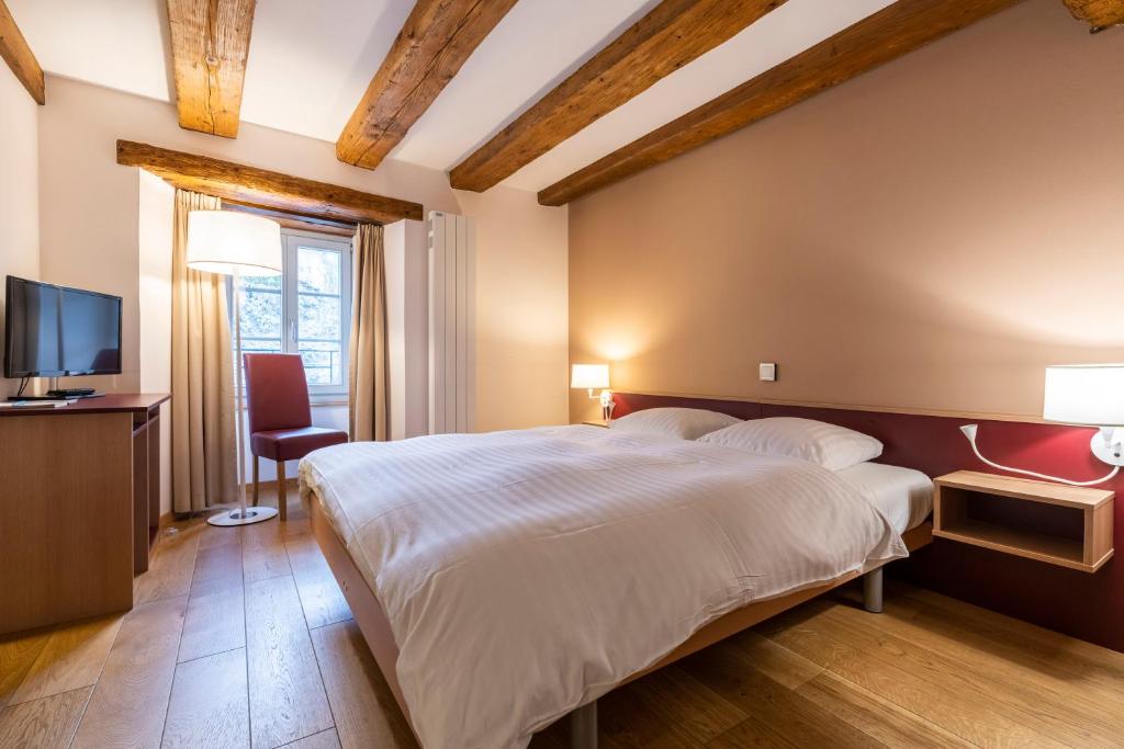 Postel nebo postele na pokoji v ubytování Le Rive Sud