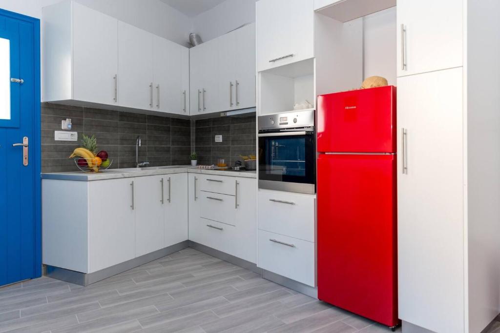 Kuchyň nebo kuchyňský kout v ubytování Santorita Suites