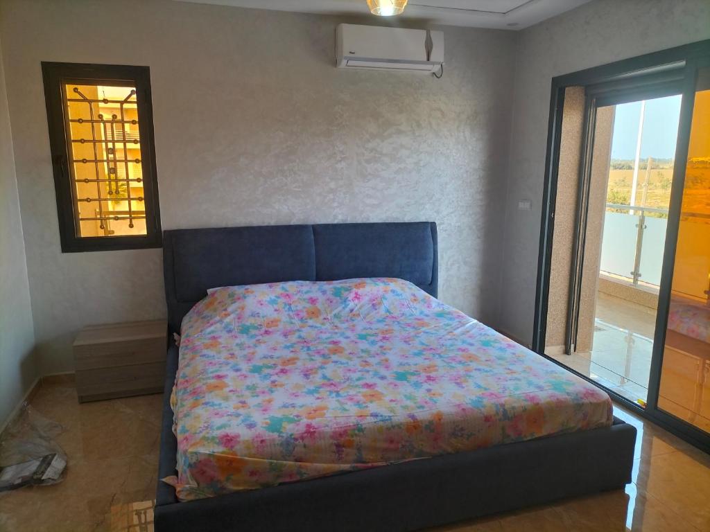 En eller flere senge i et værelse på villa palm beach Saidia