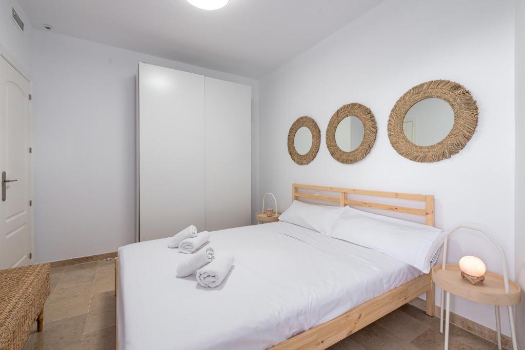 Postel nebo postele na pokoji v ubytování Small Oasis