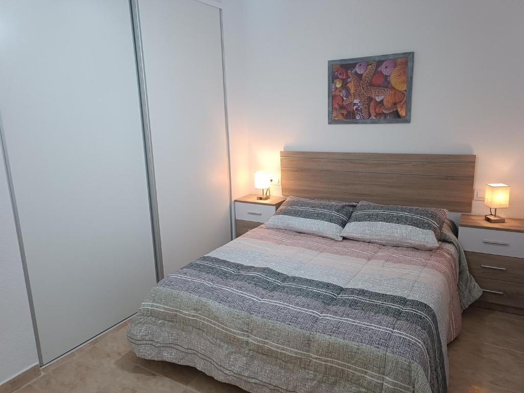Łóżko lub łóżka w pokoju w obiekcie Vera Natura Apartamento Alba