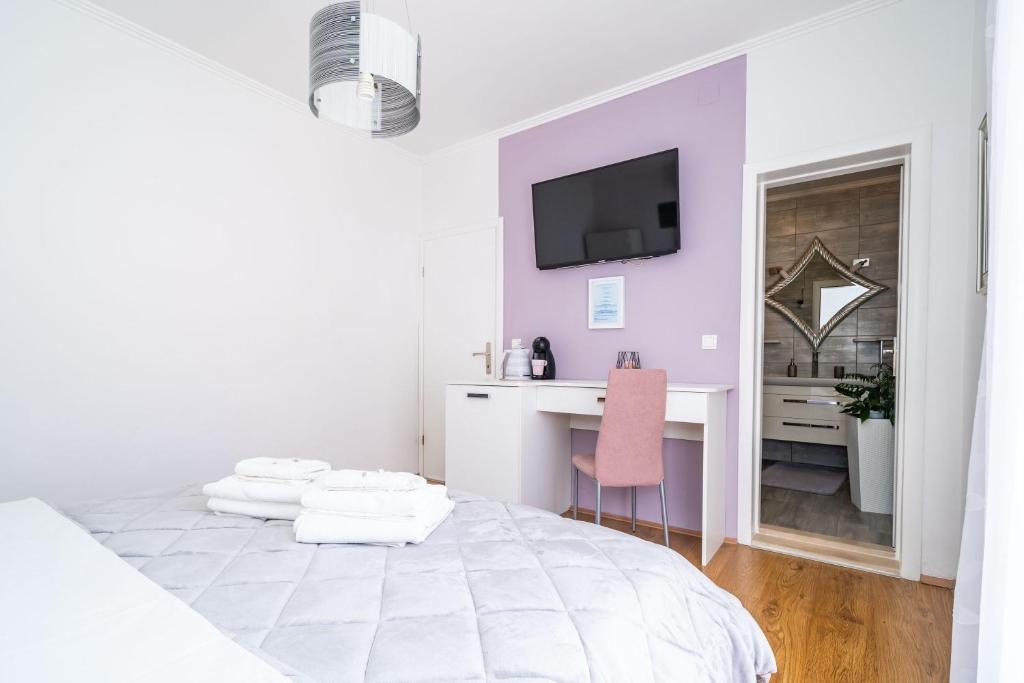 Posteľ alebo postele v izbe v ubytovaní Apartment & Rooms Duja