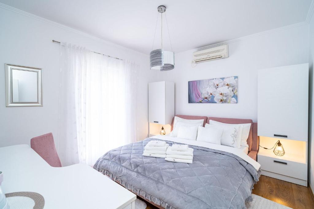 Posteľ alebo postele v izbe v ubytovaní Apartment & Rooms Duja