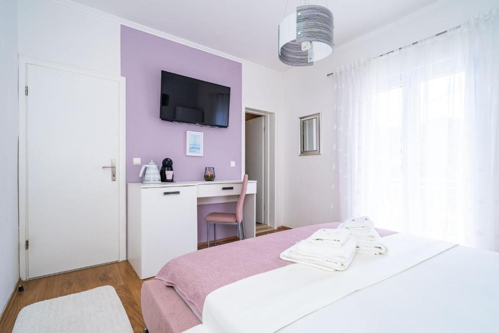Posteľ alebo postele v izbe v ubytovaní Apartment & Rooms Duja