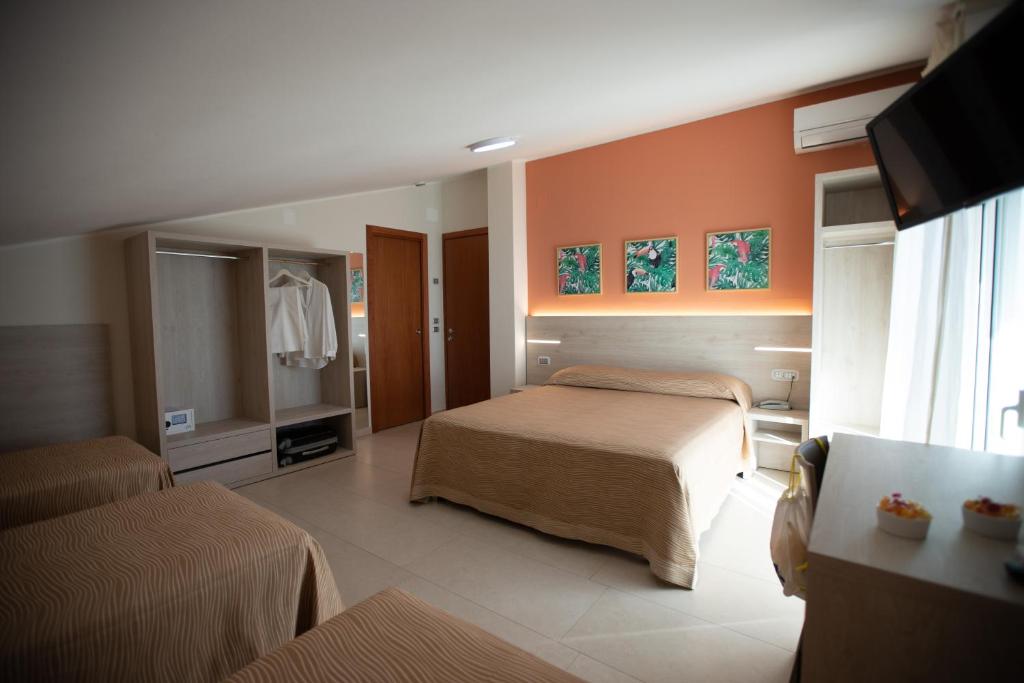 Postel nebo postele na pokoji v ubytování Hotel Palace Magnolia SPA