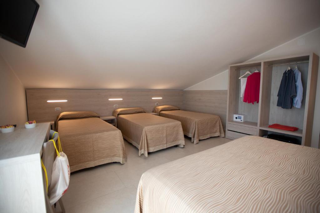 Postel nebo postele na pokoji v ubytování Hotel Palace Magnolia SPA