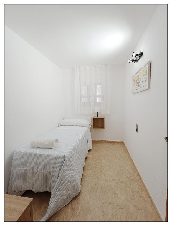 Posteľ alebo postele v izbe v ubytovaní APARTAMENTO CENTRICO JUNTO AL MAR - WIFI FREE