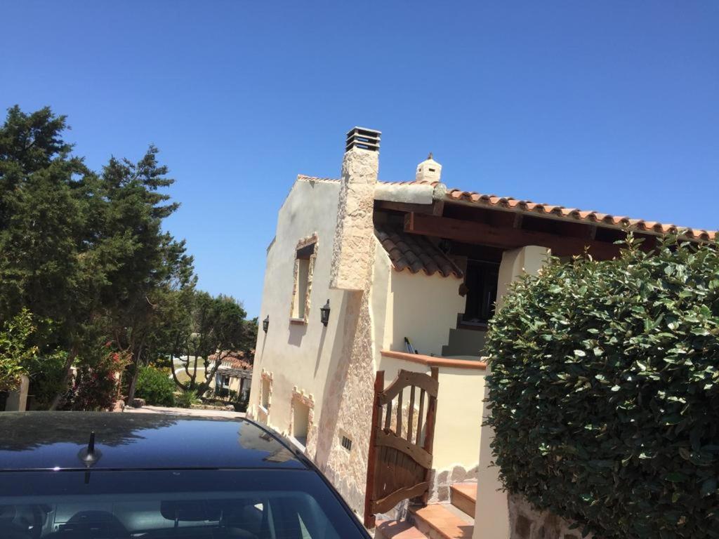 a car parked in front of a house at Villa paradiso in Stintino