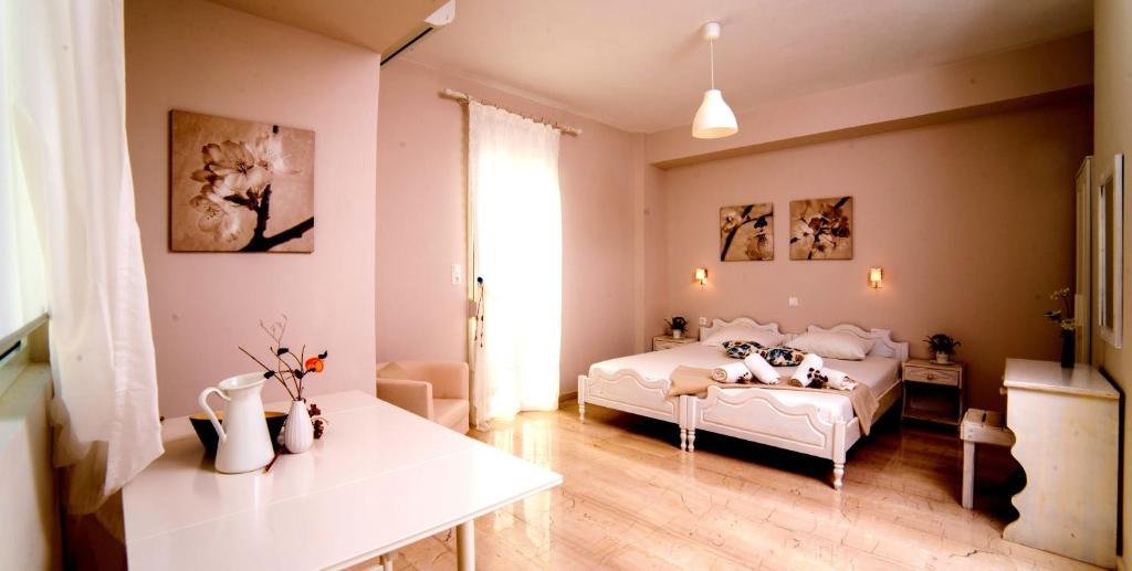 Posteľ alebo postele v izbe v ubytovaní Calma Apartments & Studios
