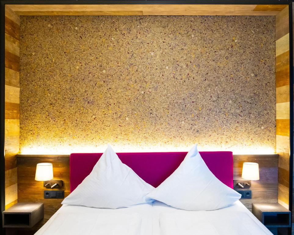 Letto o letti in una camera di Hotel Waldmühle