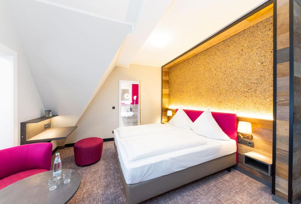 Letto o letti in una camera di Hotel Waldmühle