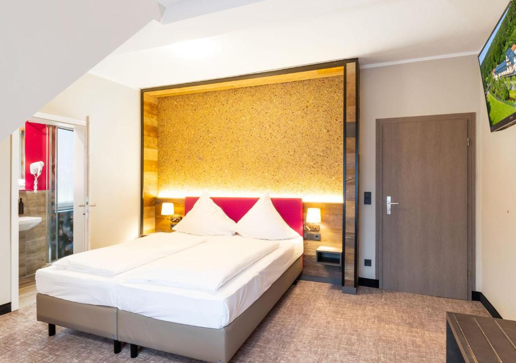 Letto o letti in una camera di Hotel Waldmühle