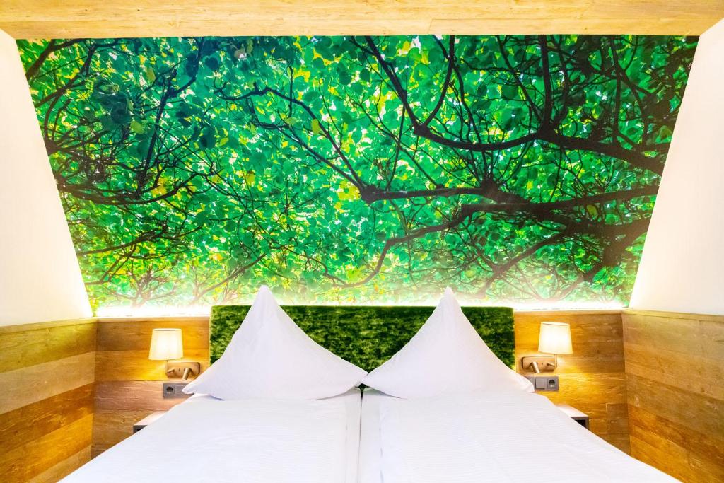 Letto o letti in una camera di Hotel Waldmühle