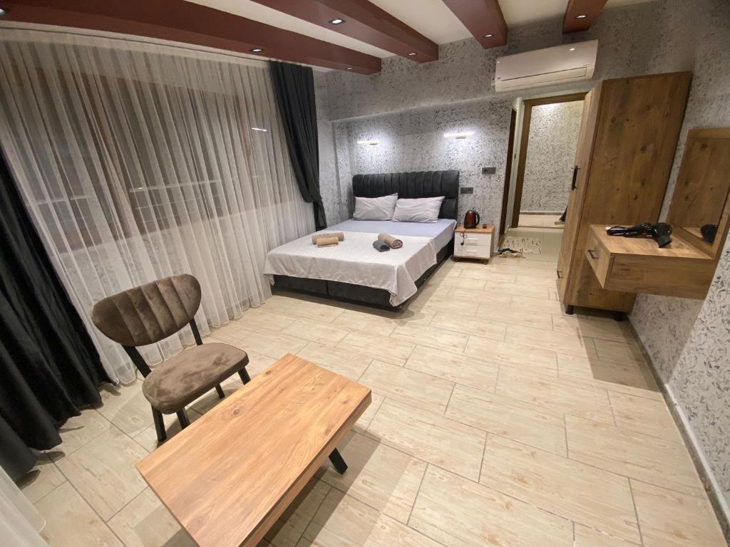 Postel nebo postele na pokoji v ubytování Grand Macit Otel