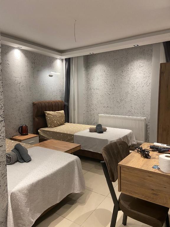 Postel nebo postele na pokoji v ubytování Grand Macit Otel