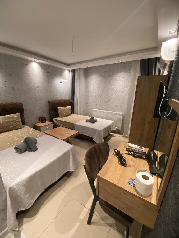 Postel nebo postele na pokoji v ubytování Grand Macit Otel