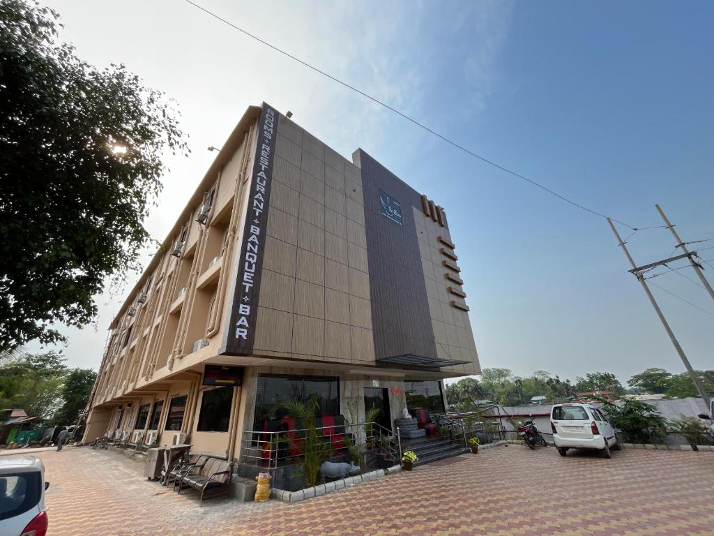 a building with a car parked in front of it at The Rhino in Guwahati